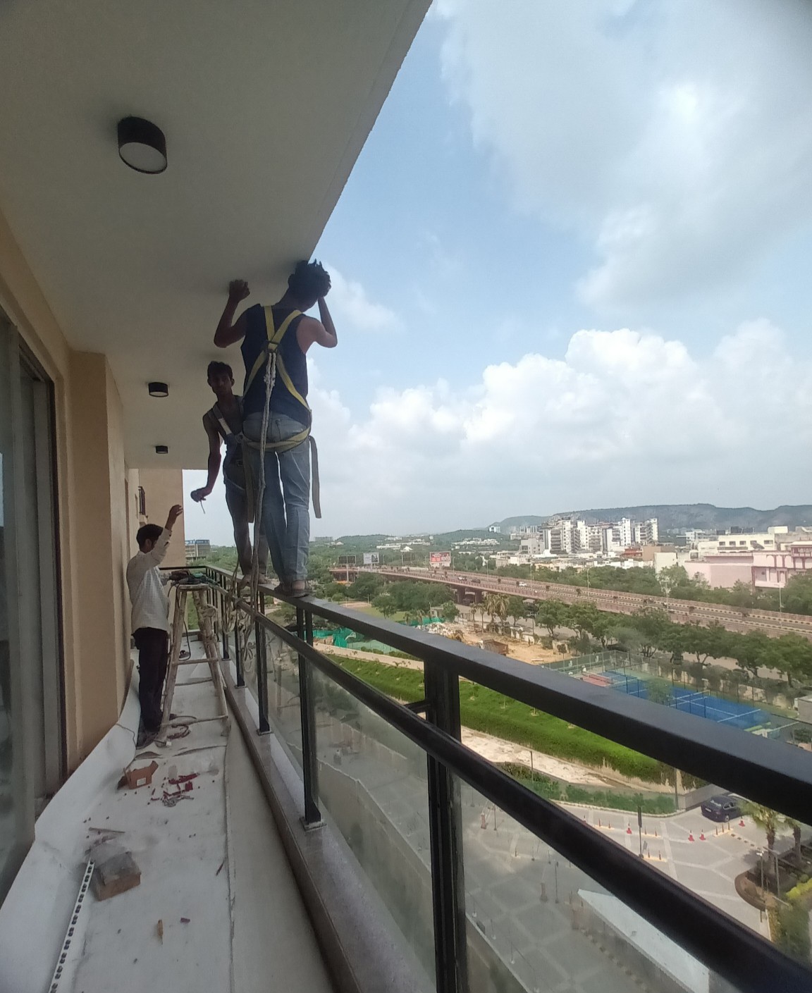Before invisible grill installation — high-rise apartment balcony in Jaipur (AI visual concept)