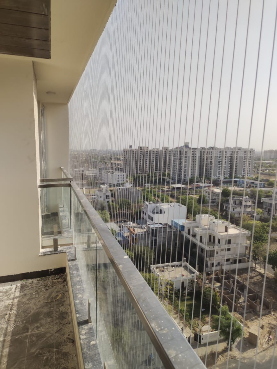 After invisible grill installation by GPC Safety Solutions — villa balcony in Jaipur (AI visual concept)