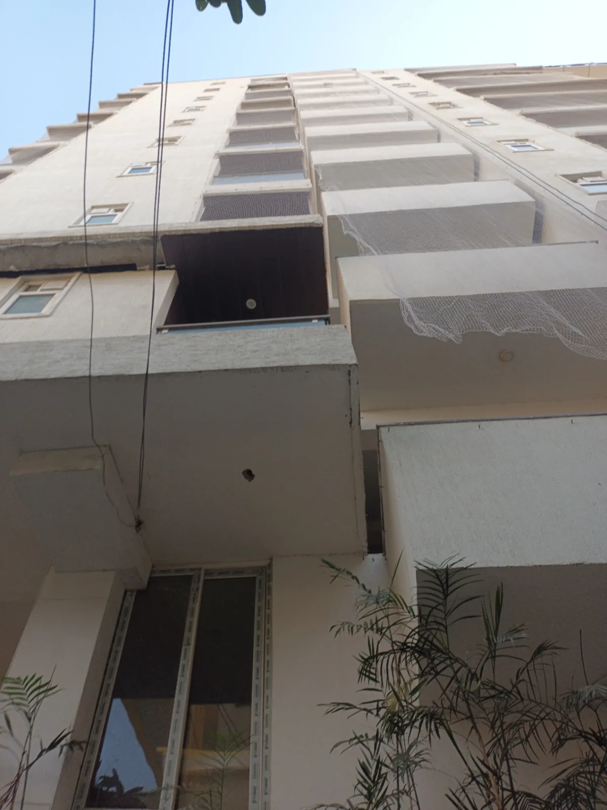 Pigeon net installation on high-rise residential building